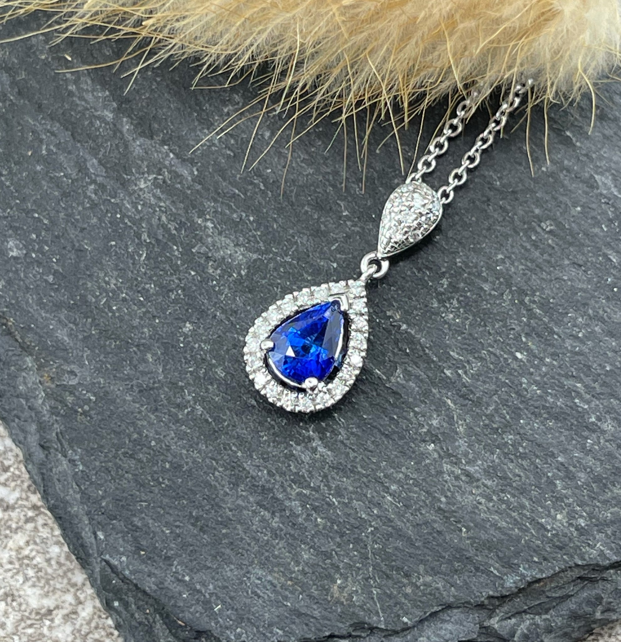 Pear shaped sapphire halo pendant