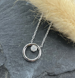Plain circle floating diamond pendant