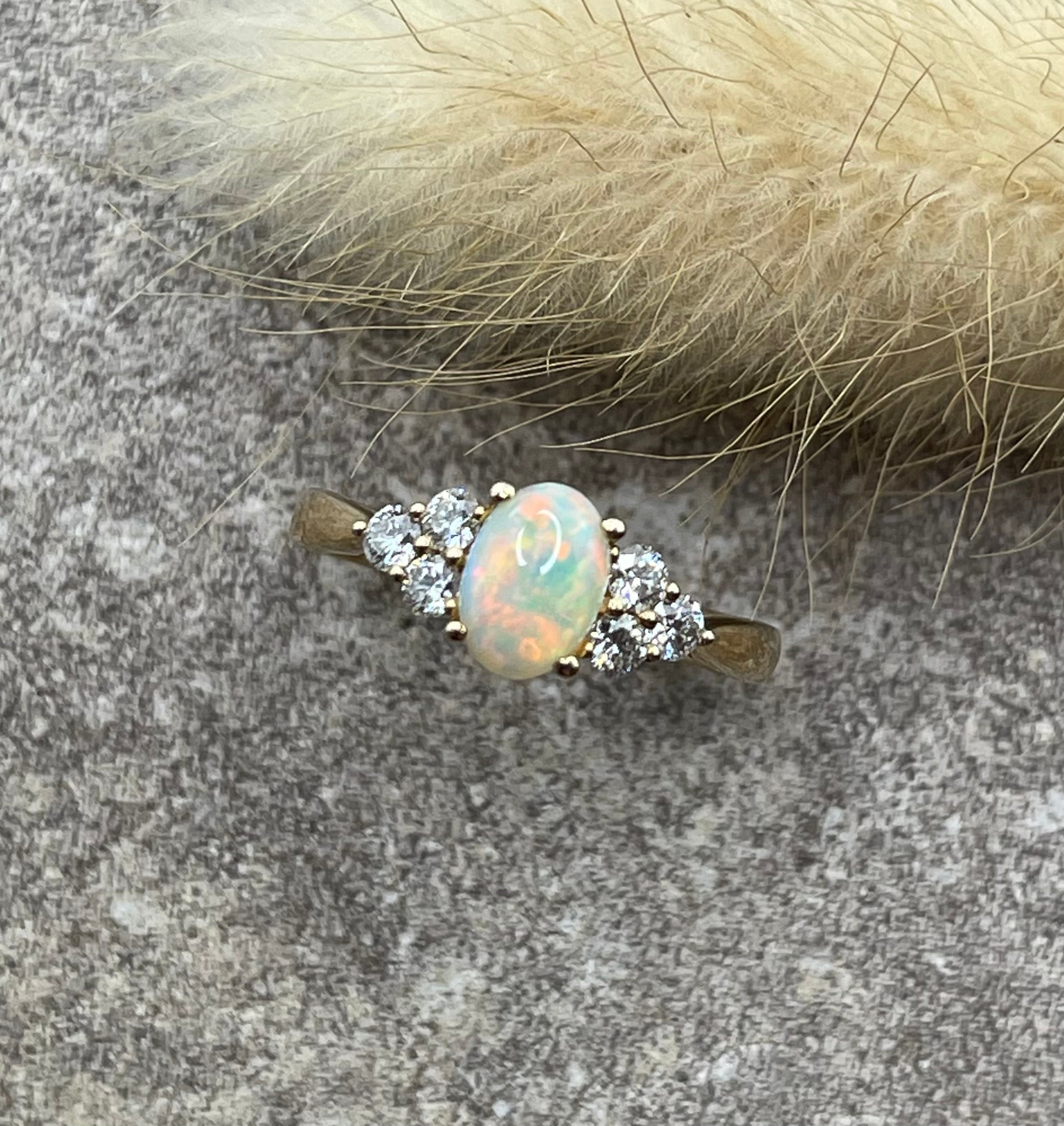 Opal and diamond trefoil ring