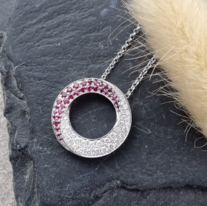 Ruby and diamond swirl pendant
