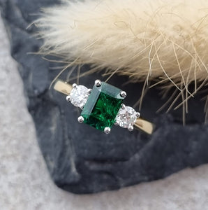 Emerald cut emerald trilogy ring