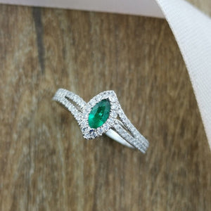 Marquise emerald halo twist ring