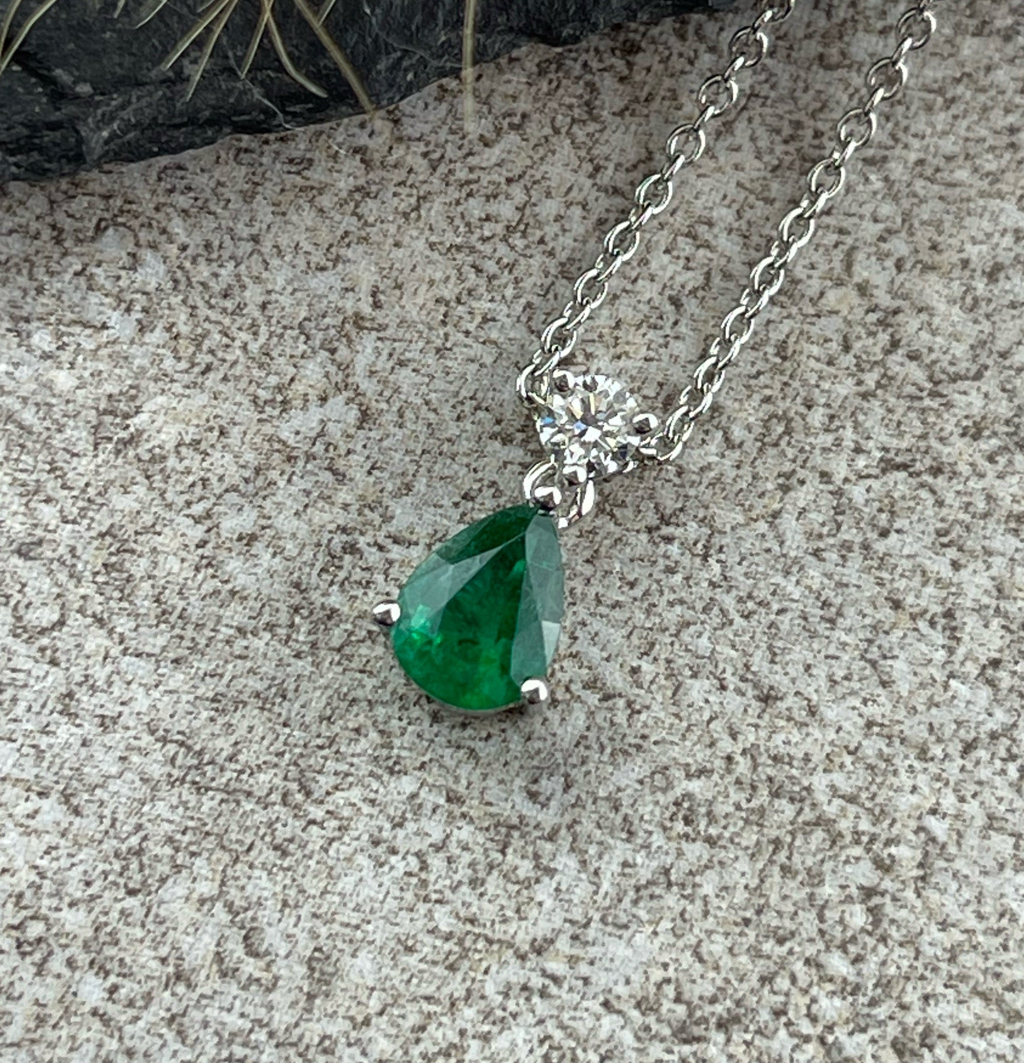 Pear cut emerald and diamond pendant