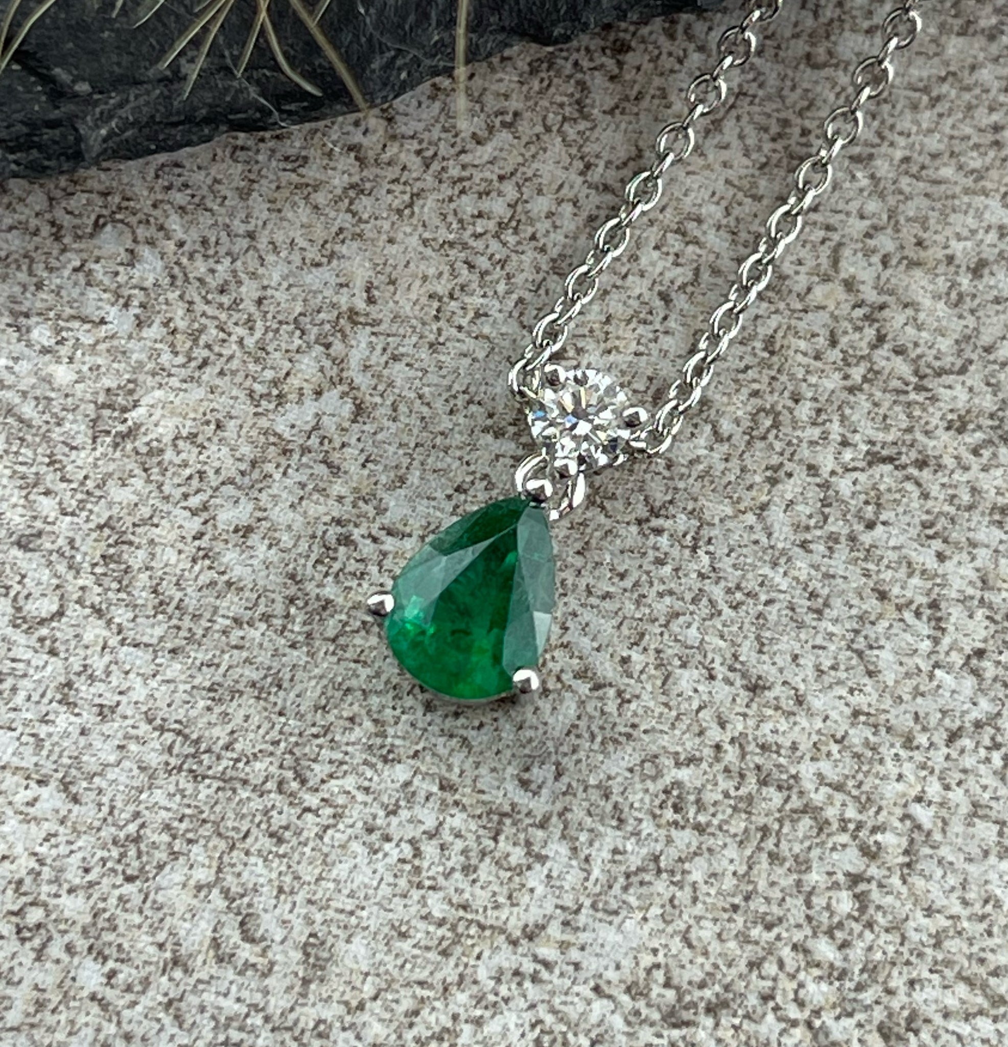 Pear cut emerald and diamond pendant