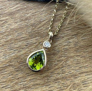 Peridot and diamond pendant