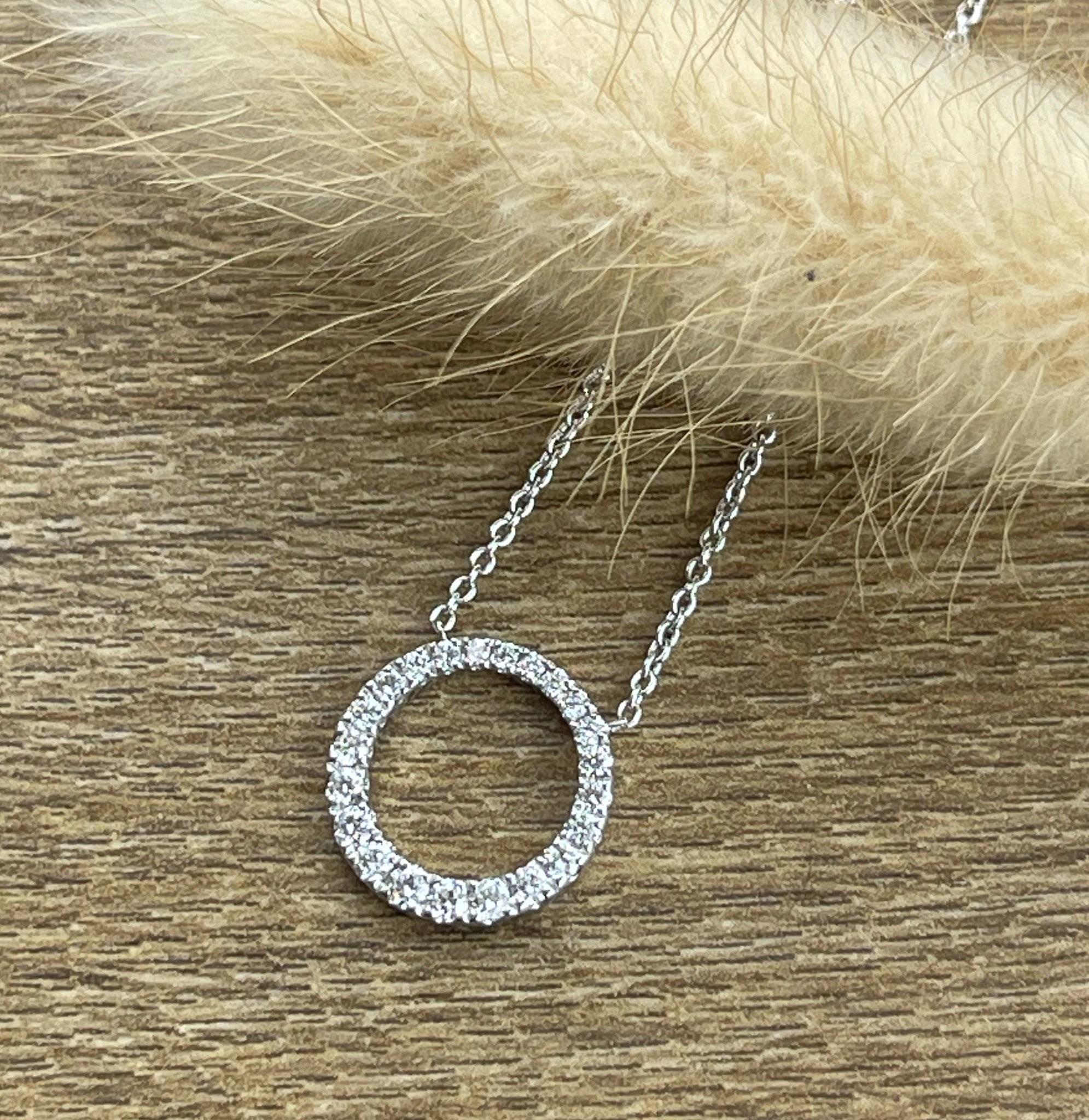 Diamond graduated circle pendant